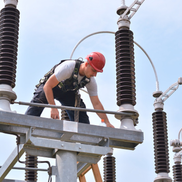 man on power tower