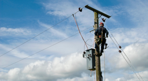 worker on electrical pole