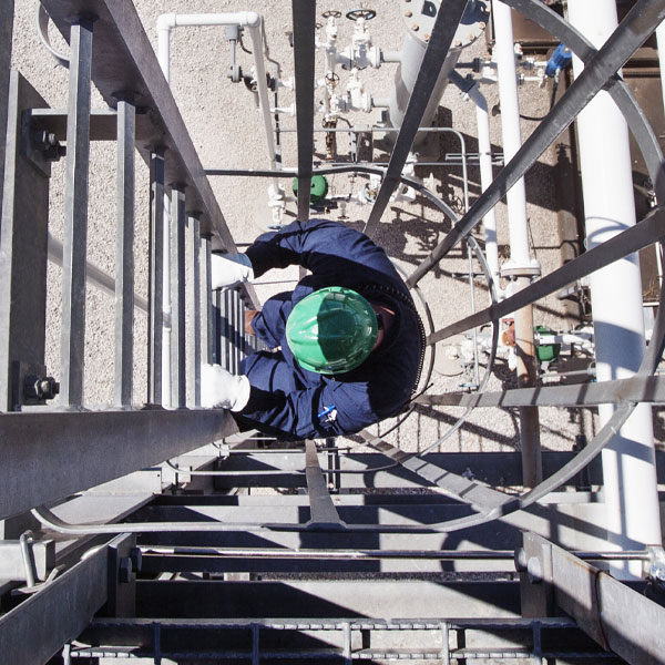 man on ladder climbing tower