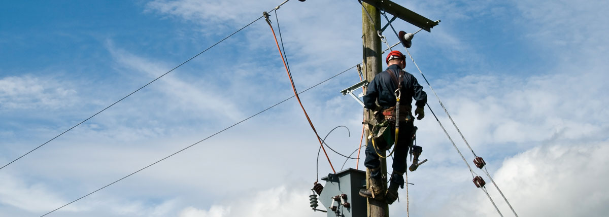 worker on electrical pole